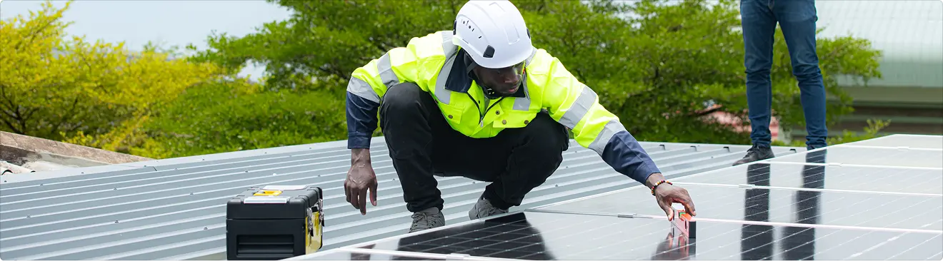 Solar worker installing panel